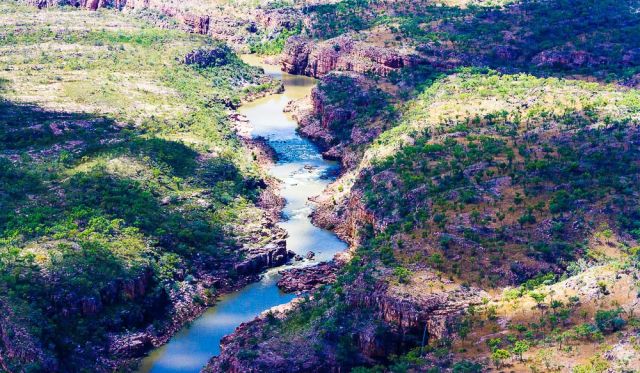 The Katherine River flows through 13 separate gorges that weave their way through the Arnhem Land Plateau.