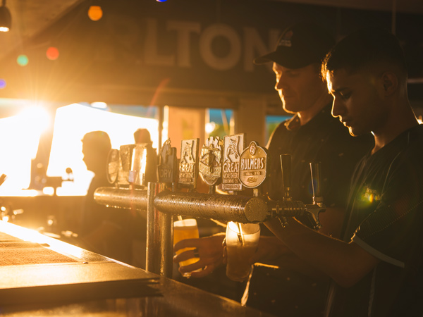 Pouring drinks at the Bali Bar at Darwin Ski Club. 