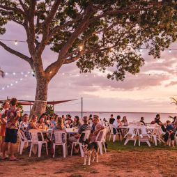 People relaxing at Darwin Ski Club at sunset