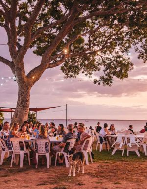 People relaxing at Darwin Ski Club at sunset
