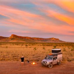 a man standing with a bonfire setup at sunset, the Kimberly and Gibb River Road trip