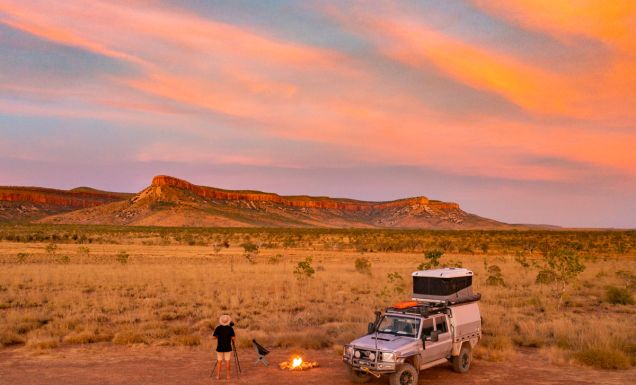 a man standing with a bonfire setup at sunset, the Kimberly and Gibb River Road trip