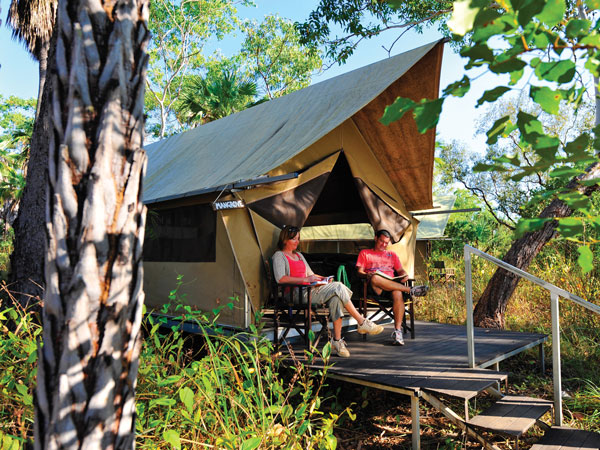 a couple sitting outside their tent at Mitchell Falls Wilderness Lodge