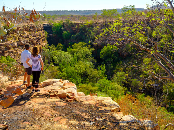 two people atop The Grotto near Wyndham