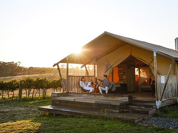 Couple enjoying a glamping experience at Nashdale Lane Wines, Orange, NSW, Australia