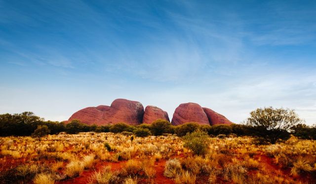 Kata Tjuta (formerly the Olgas) rises higher than Uluru