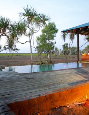 Firepit and infinity pool Bamurru Plains Lodge