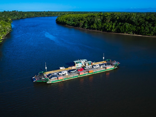 The Daintree Ferry crossing the Daintree River. (Image: Tourism and Events Queensland)