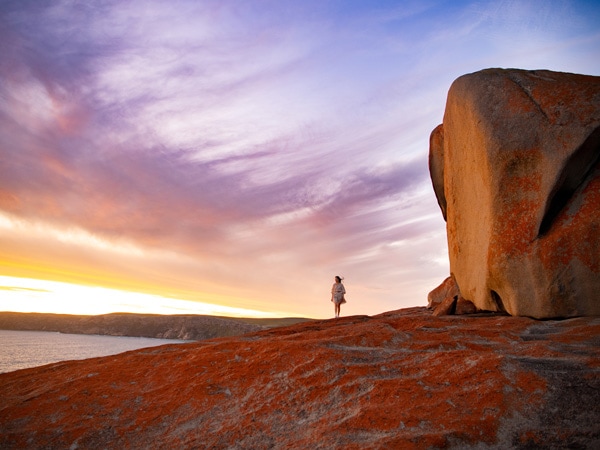 Woman at Remarkable Rocks on Kangaroo Island Odysseys tour. 