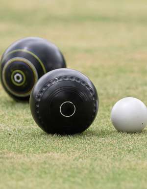 Barefoot lawn bowls at the bowlo