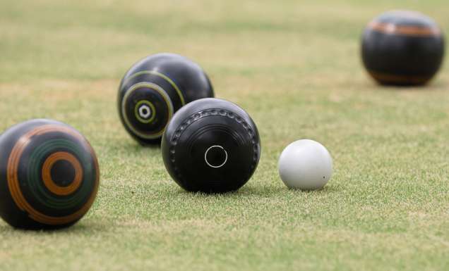 Barefoot lawn bowls at the bowlo
