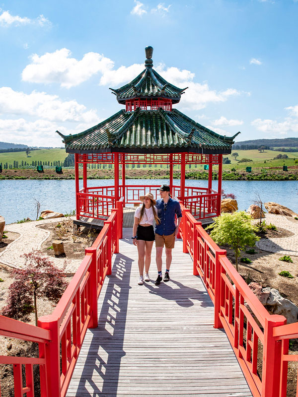 a couple walking along the Chinese Pagoda, Mayfield Garden