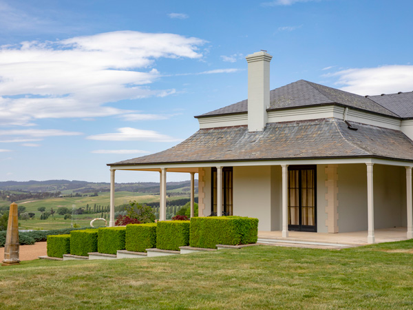 a building surrounded by manicured gardens in Mayfield