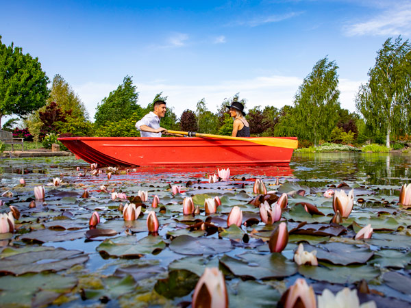 a couple rowing a boat during the Spring Festival in Mayfield Garden