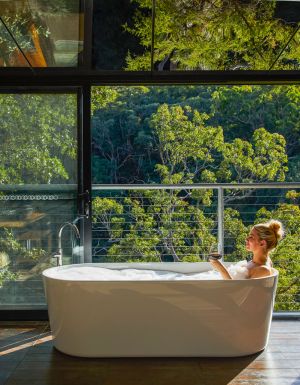 a woman dipping in the tub at Spicers Sangoma, Bowen Mountain