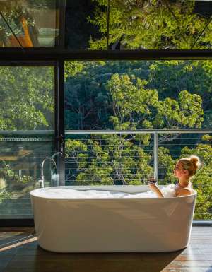 a woman dipping in the tub at Spicers Sangoma, Bowen Mountain
