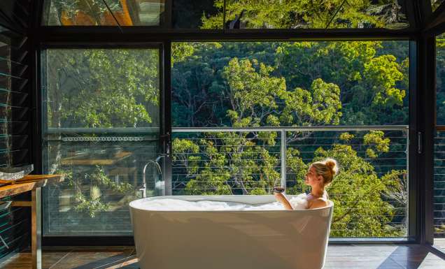 a woman dipping in the tub at Spicers Sangoma, Bowen Mountain