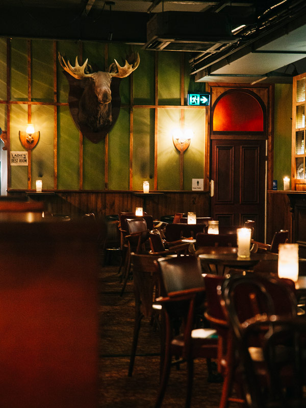 a dimly lit bar interior at Sneaky Tony’s, Perth