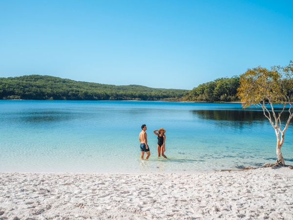 Couple swimming at Lake McKenzie K'gari