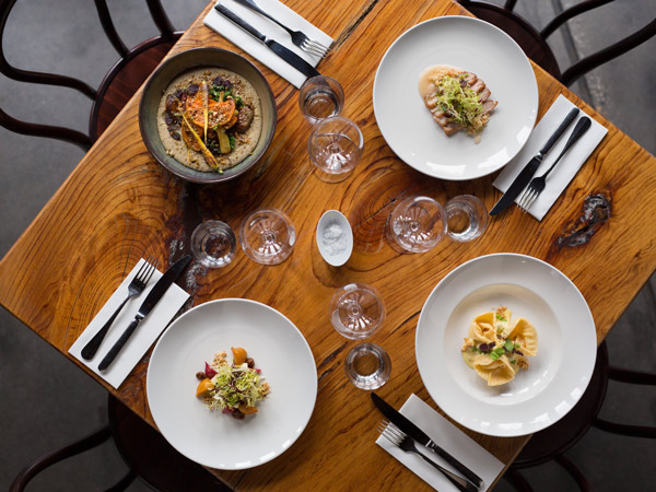 Four minimalist plates from Bendooley Estate in Berrima