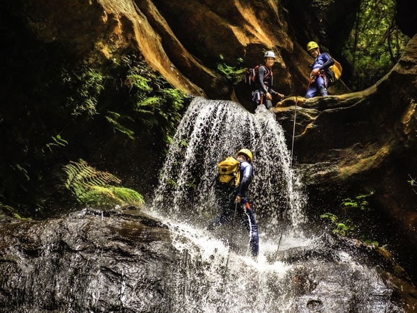 people slipping down the Empress Falls, Blue Mountains