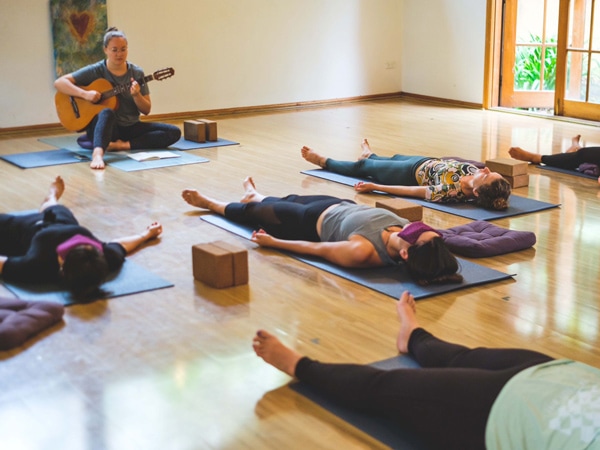 a group of people doing meditation at Happy Buddha Retreats