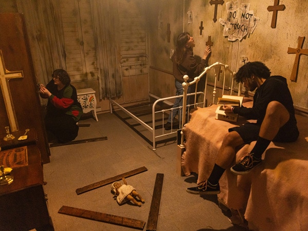 a group of friends working together to escape The Rush Escape Room in St Kilda