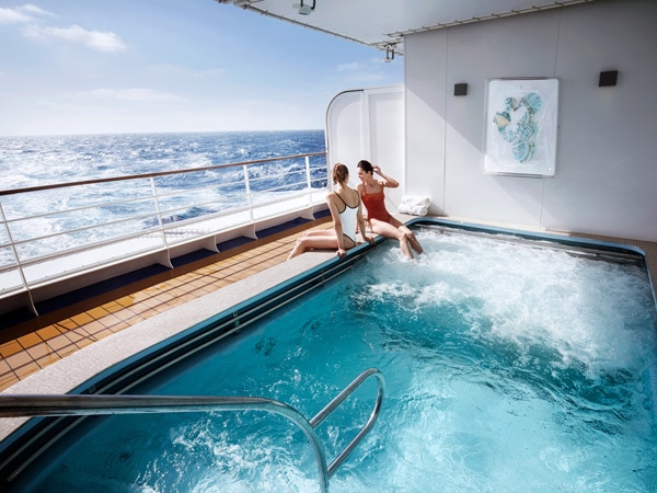two ladies chilling out at the outdoor jacuzzi of The Zagara Spa