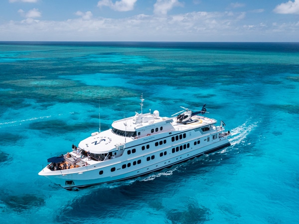 an aerial view of the True North cruise sailing across the crystal blue waters