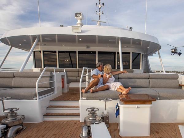 an old couple relaxing onboard True North