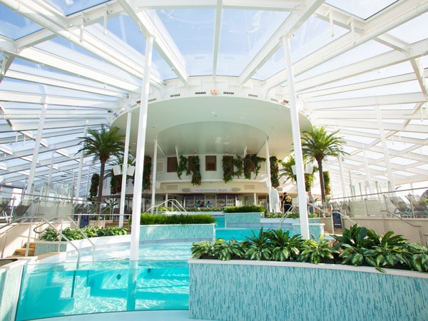 an indoor pool onboard Ovation of the Seas