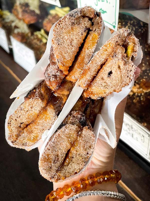 a person holding pastries