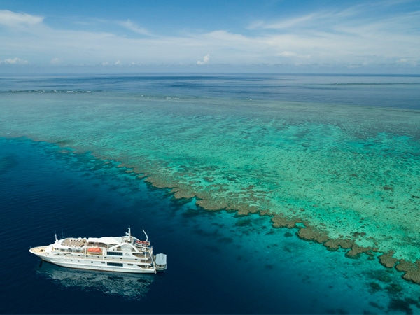 Coral Discoverer sailing across Great Barrier Reef