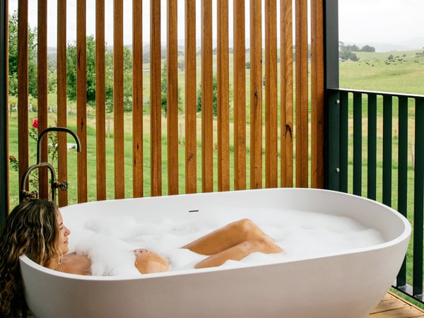 The freestanding outdoor bathtubs at Cupitt's Estate on the NSW South Coast
