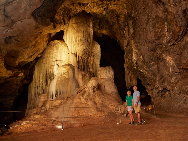 a father and son exploring Wellington Caves