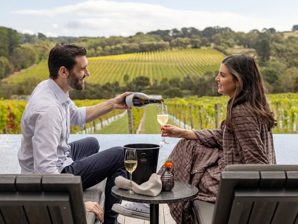a couple drinking a glass of Champagne