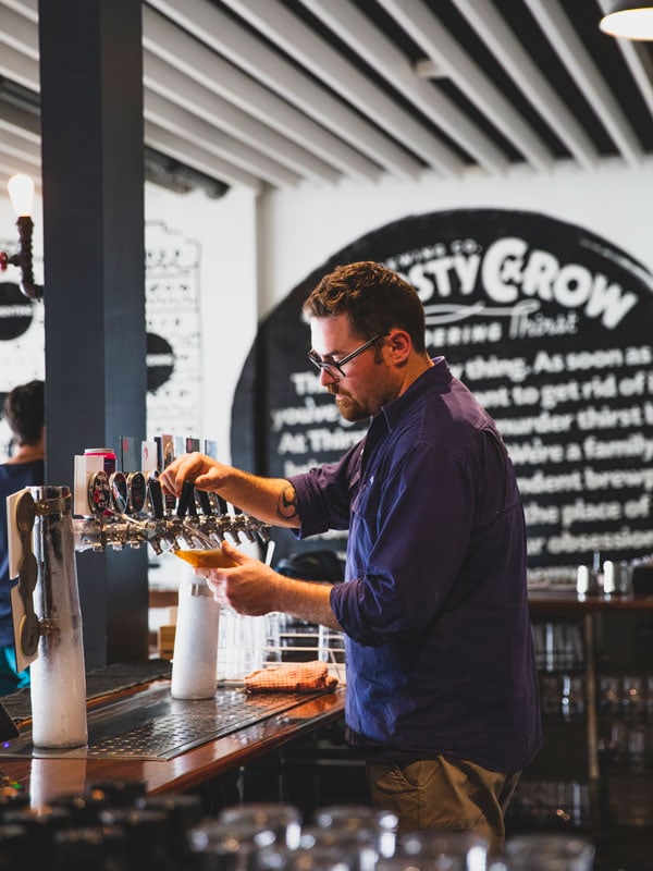 Beer being poured at the Thirsty Crow Brewery, Wagga Wagga. (Image: Destination NSW)
