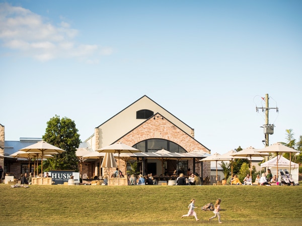 kids running outside Husk Distillers