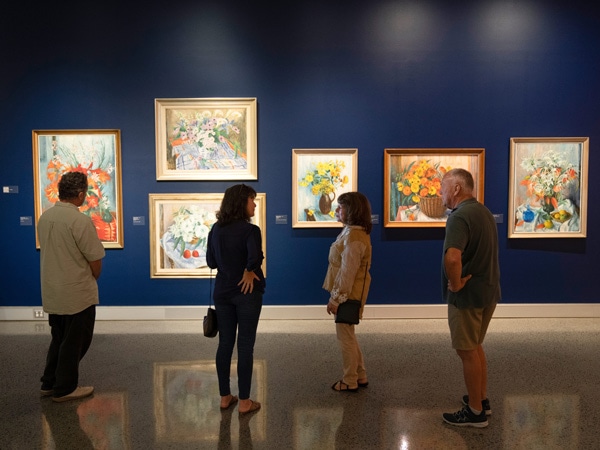 guests admiring artworks displayed on the walls at Tweed Regional Gallery