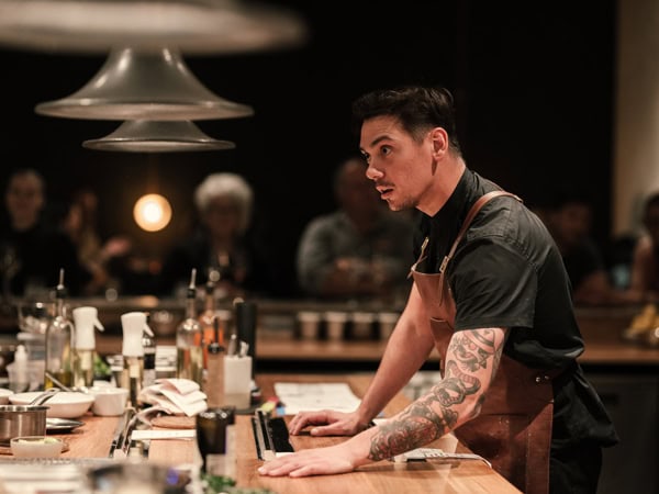 Chef Jake Kellie preparing in the kitchen of arkhé, Adelaide
