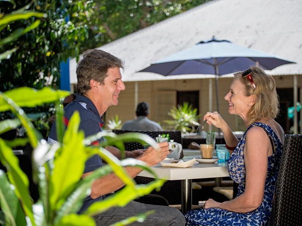 an old couple having breakfast at Eva’s Café, George Brown Darwin Botanic Gardens