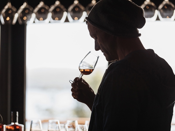 a guy sampling a glass of whisky at Tasmanian House of Whisky