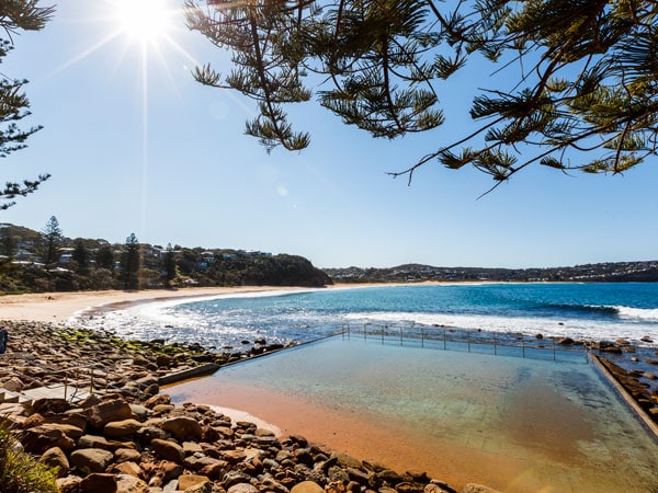 Sunny day at Macmasters Beach and ocean pool on the Central Coast.