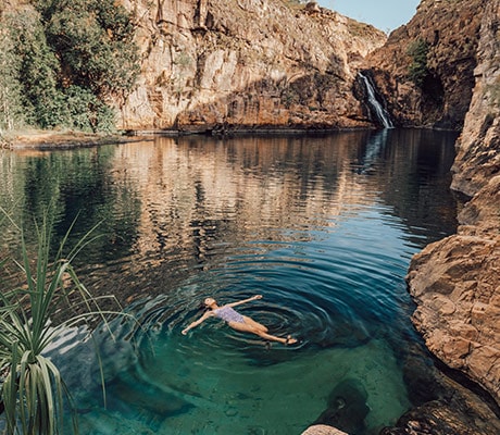 Girl relaxing at Barramundi Gorge (Maguk)