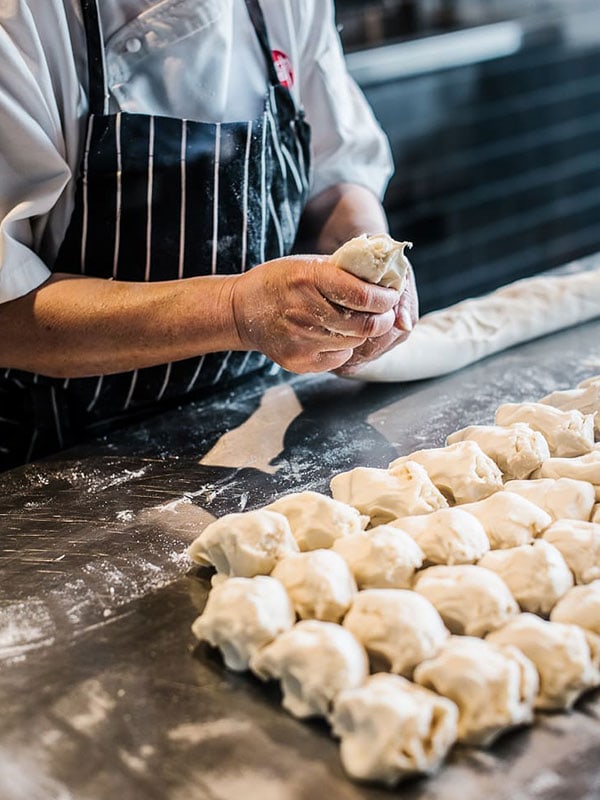 Dumplings are hand-rolled in front of you at New Shanghai in Brisbane.