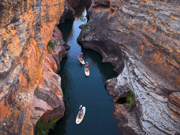 Stand-up paddle boarding down Cobbold Gorge in Queensland