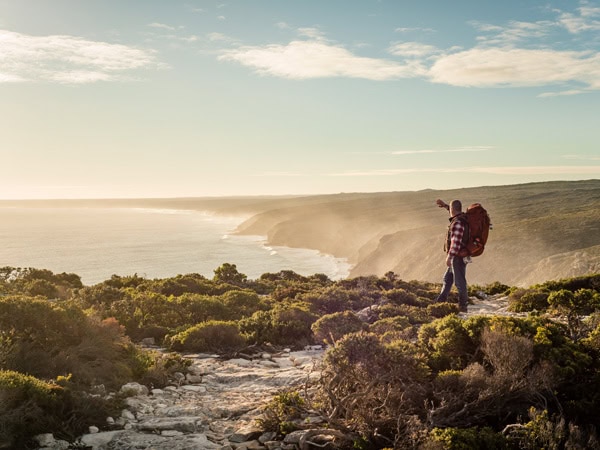 a hiker standing on top of the Kangaroo Island Wilderness Trail