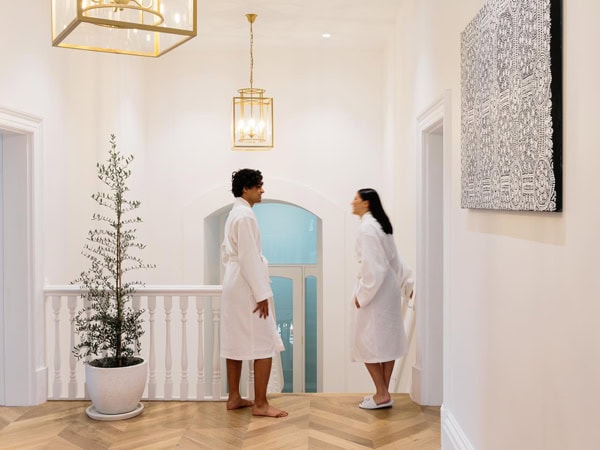 a couple standing in robes at Davaar House, Adelaide