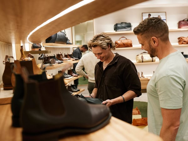 visitors browsing through the boots on display at R.M. Williams
