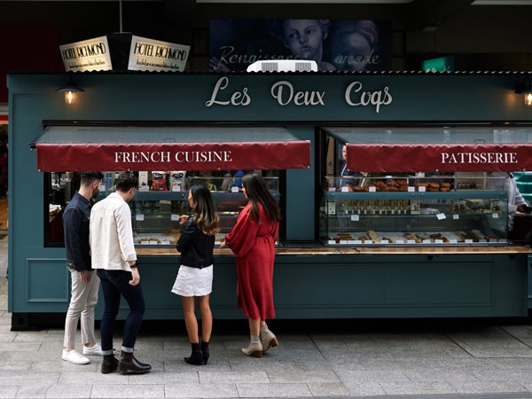 people buying French delicacies at Les Deux Coqs in Rundle Mall
